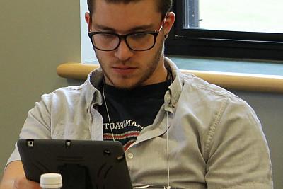 Student looks at tablet screen